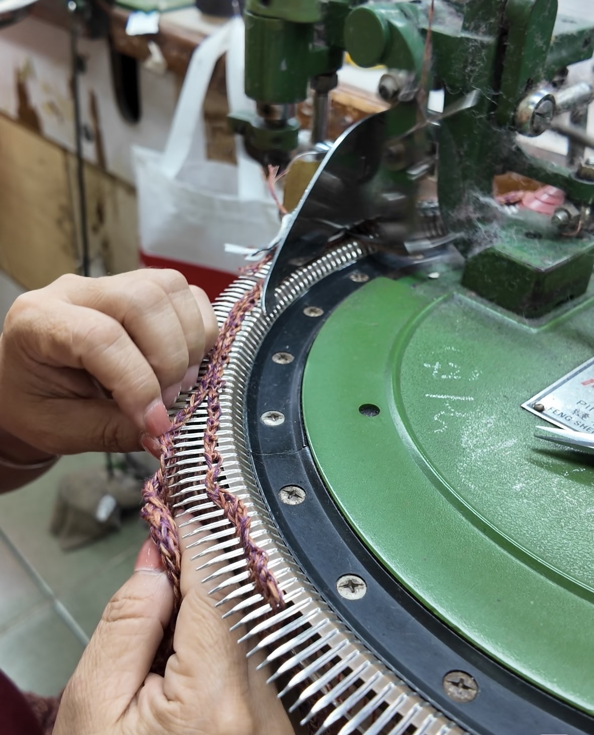 Linking & assembly — hand-feeding knit panels onto circular linking machine needles
