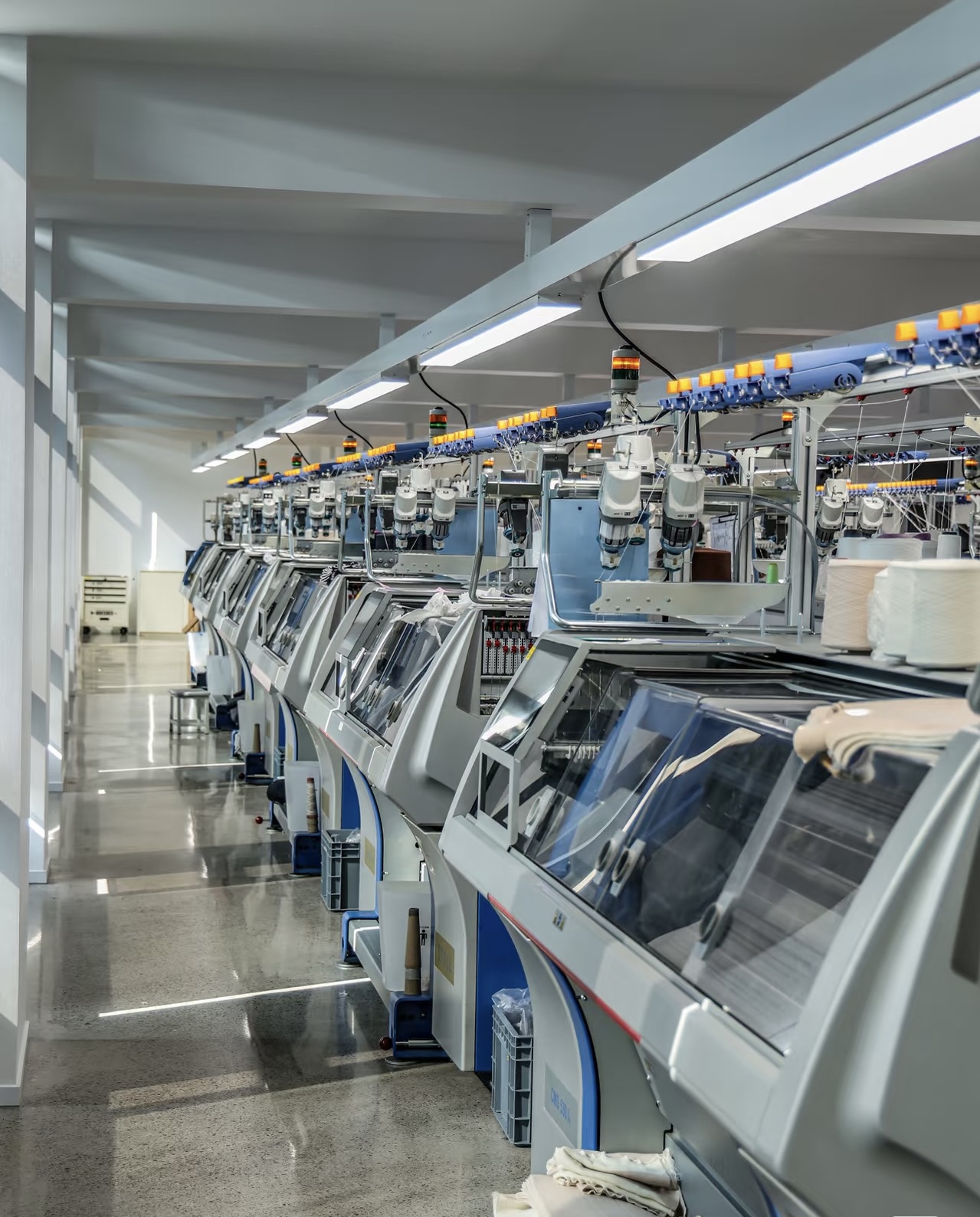 Computerized flat knitting machines in production floor
